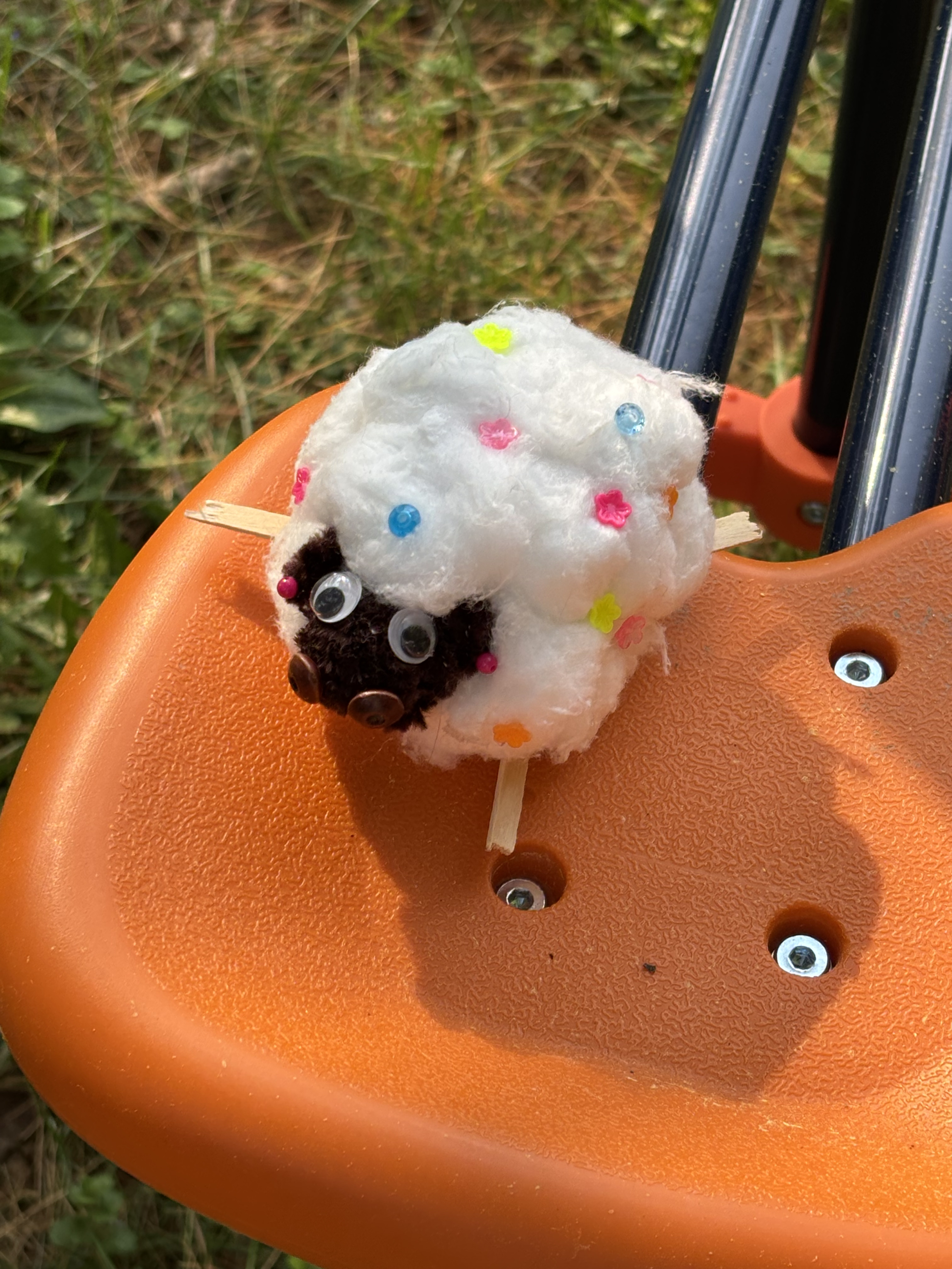 A small handmade sheep craft outside